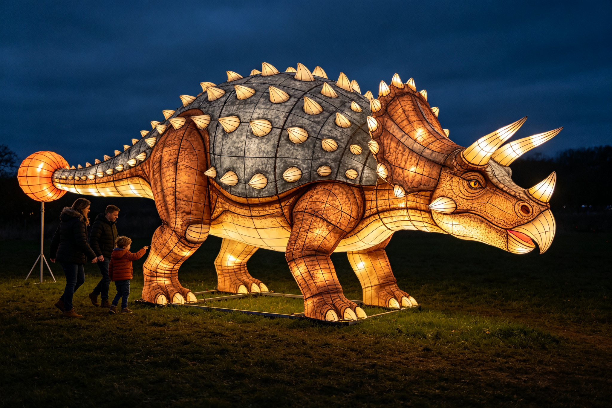 Brown ankylosaurus dinosaur lantern with armored back and club tail at festival with family